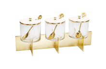 Load image into Gallery viewer, Three Glass Canister Set White Lids Gold Block Base